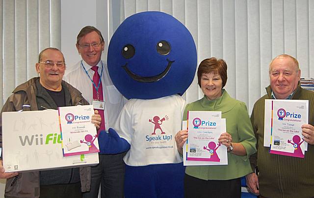 The lucky winners are presented with their prizes by John Pierce, Chairman of NHS HMR, and the Speak Up mascot.