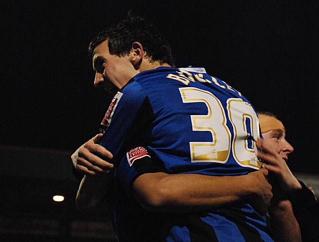 Buckley celebrates his goal with Joe Thompson and Nicky Adams.