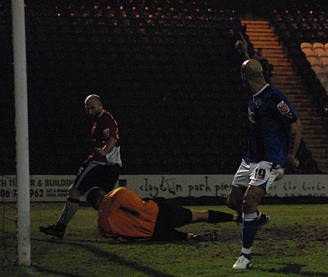 Lee Thorpe thinks he has scored but Barry Roche saves his effort.