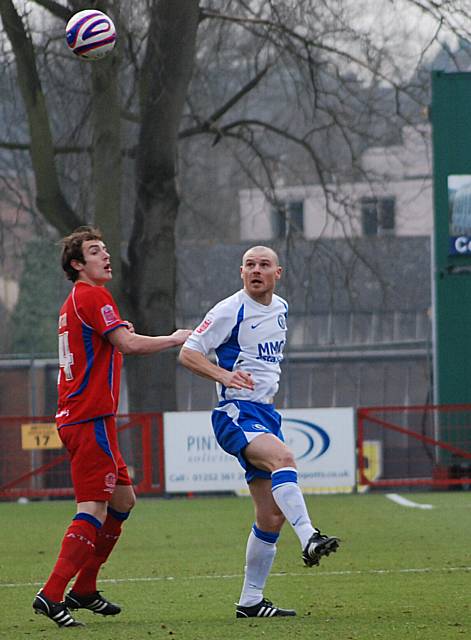 Gary Jones plays a ball over the top.