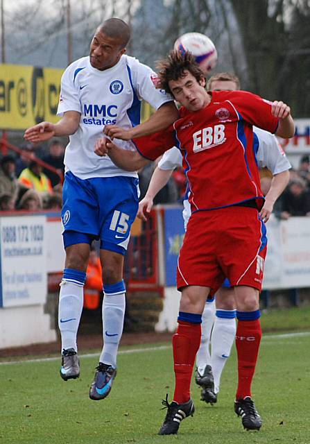 Joe Thompson goes for a header with Danny Hylton.