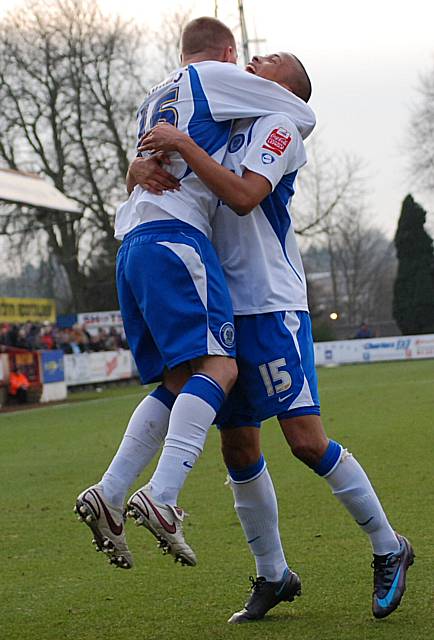 Thompson and Adams celebrate.