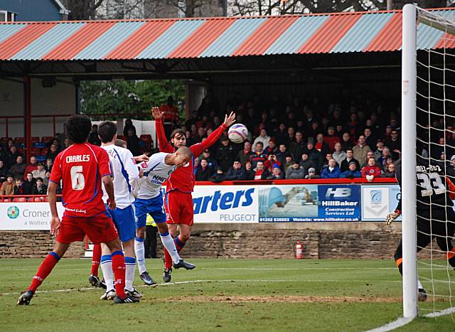 Thompson powers in the header that secures his hat-trick.