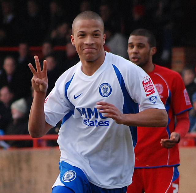 Joe Thompson celebrates his hat-trick goal at Aldershot.