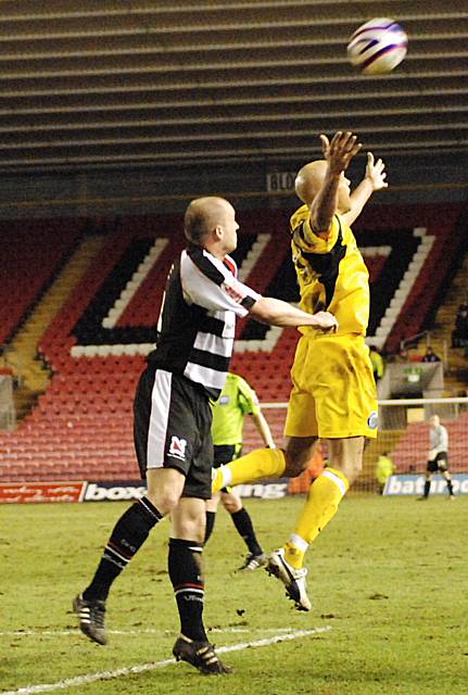 Thorpe appeals for a push in the back as White wins another header.