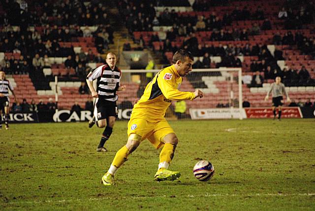 Man-of-the-Match Le Fondre sets off on another Dale attack.