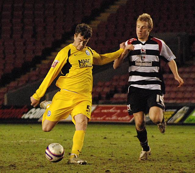 Clark Keltie fires in a shot against his former club.