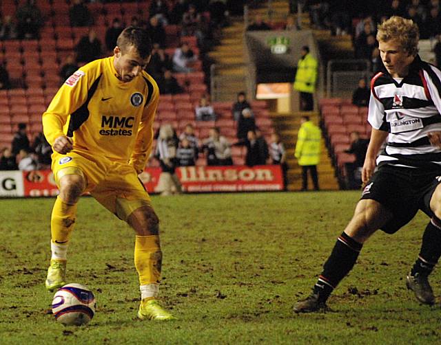 Le Fondre holds the ball up against Curtis Main.