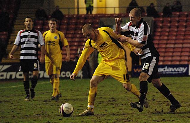 Adams tussles for the ball with Ryan Valentine.