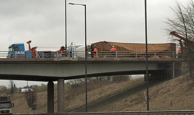 The scene of the overturned lorry from the M62 eastbound carriageway.