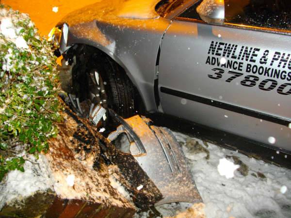 Garden wall demolished by out of control taxi