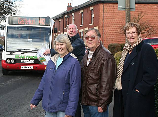 Keep our bus: Councillor Peter Davison flags down a bus with residents Irene Conroy-Goulden, James Goulden and Councillor Pat Flynn