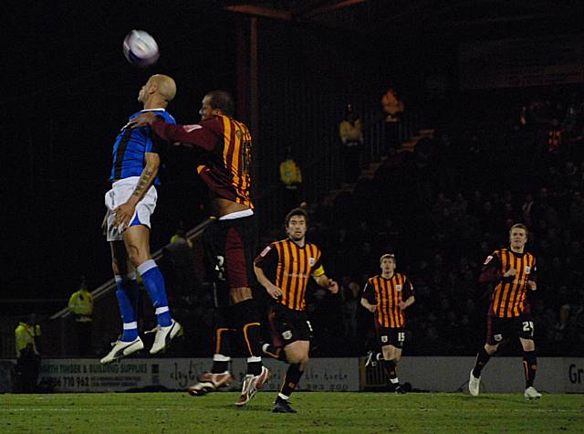 Lee Thorpe wins a header against Matt Clarke.