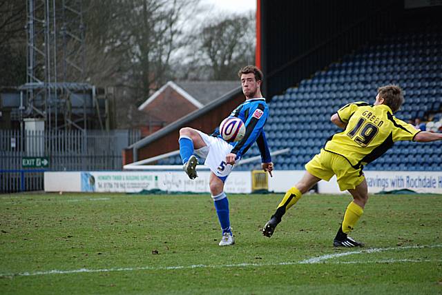 Clark Keltie puts the ball into the Rotherham box.