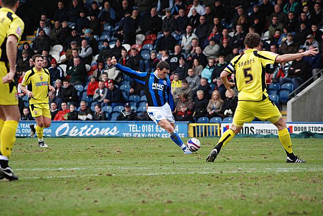 Adam Rundle hits a shot from the edge of the box.