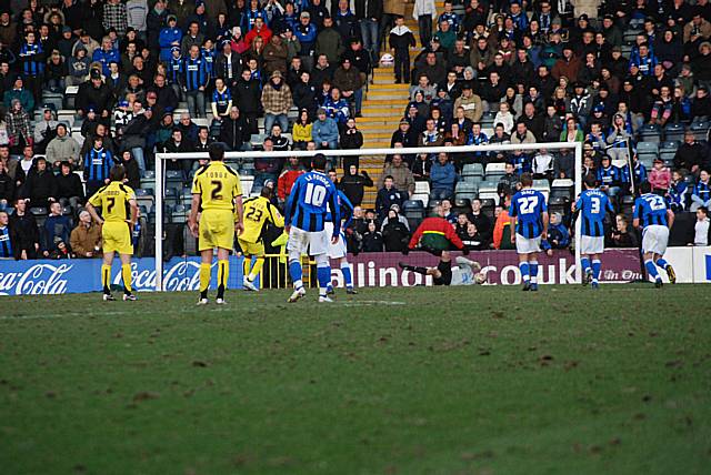 Reuben Reid's penalty cannons up off the crossbar.