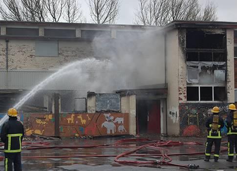 Firefighters tackle the blaze at the former Langley school on Thirlmere Drive.