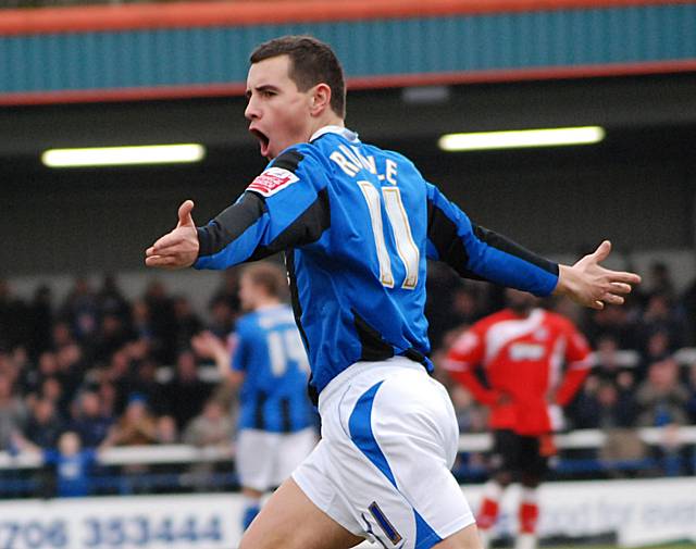 Rundle wheels away to celebrate his goal.