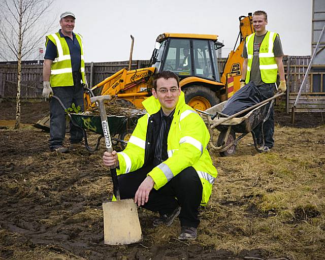 Duncan Cooper of Rochdale Development Agency (front) with Mike Quigley Groundwork Supervisor (left) and volunteer Matthew Taylor (right).