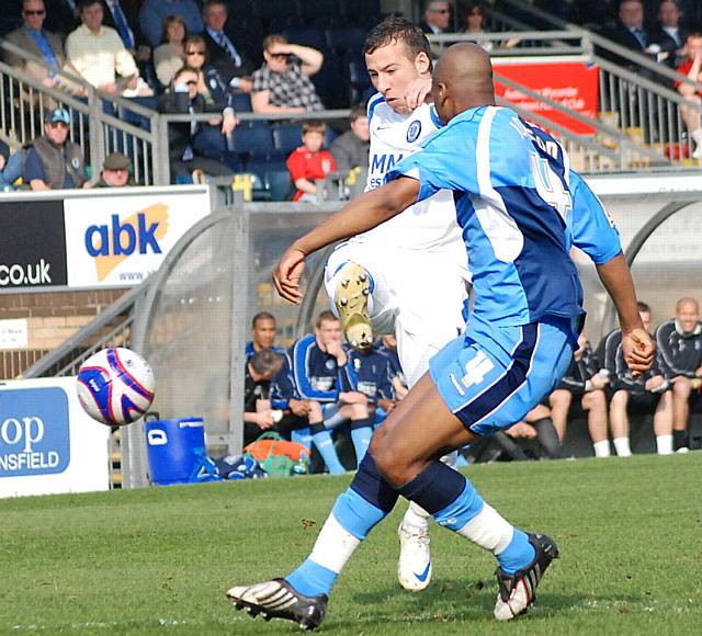 Adam Le Fondre fires in a first half shot.