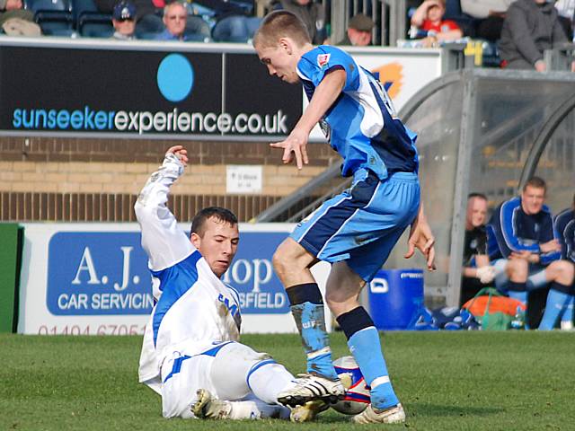 Le Fondre tackles Lee Sawyer.