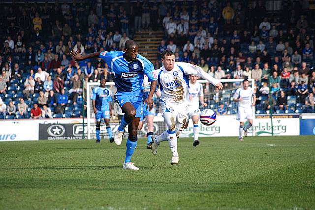 Le Fondre battles with Will Antwi for possession.