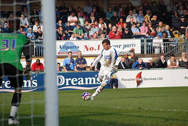 Le Fondre puts the ball back across goal.