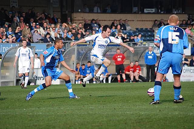 Dagnall evades Lewwis Spence's challenge.