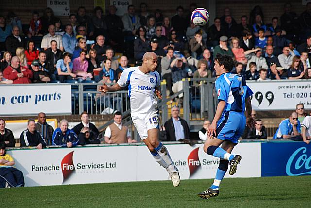 Thorpe nods the ball over Craig Woodman.