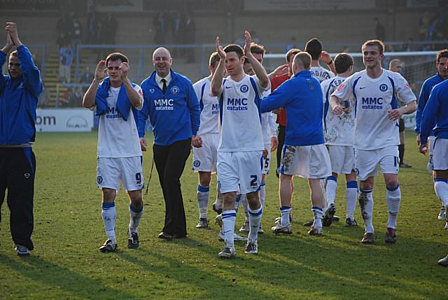 Keith Hill and his players come over to the fans to celebrate victory.