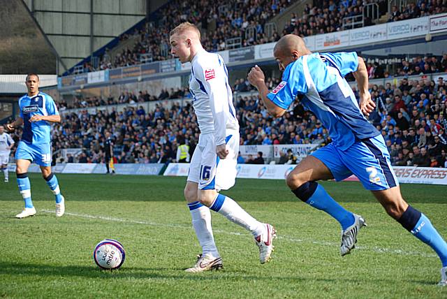 Nicky Adams cuts inside Lewis Hunt.