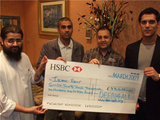 Islamic Relief representative along with the Deen For All team and Adam of Karim's Restaurant with a cheque for the final total raised. 