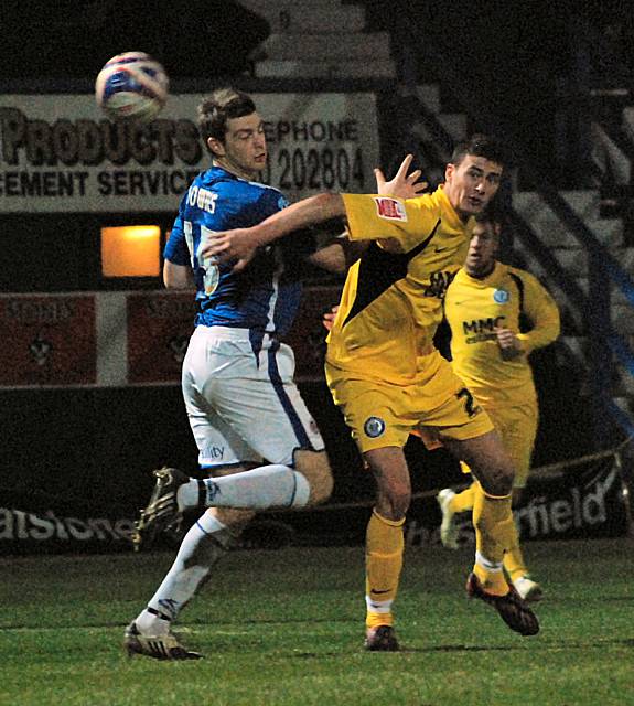 Madine holds off Downes.