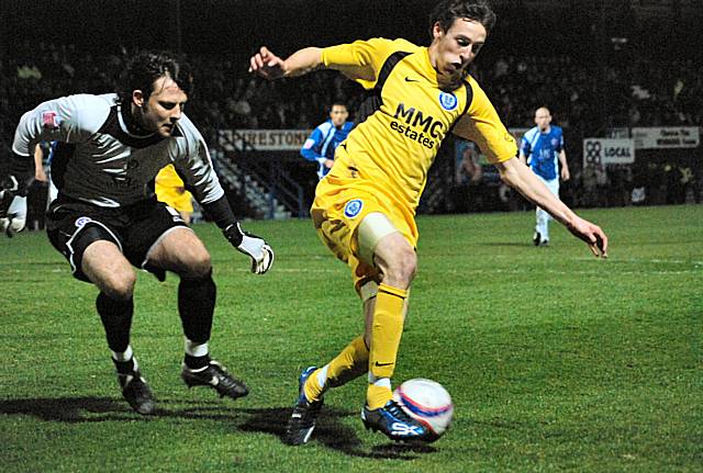 Will Buckley turns away from Lee inside the Chesterfield box.