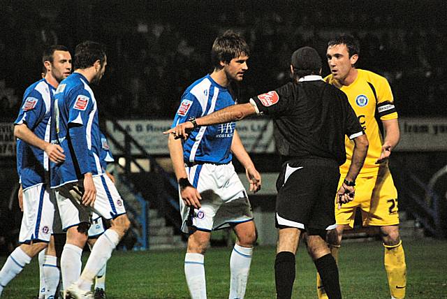 Referee Jarnail Singh appears to point to the spot after Dale appeal for a handball on the line but play eventually restarts with a goal kick.