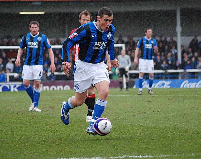 Adam Rundle heads for goal.