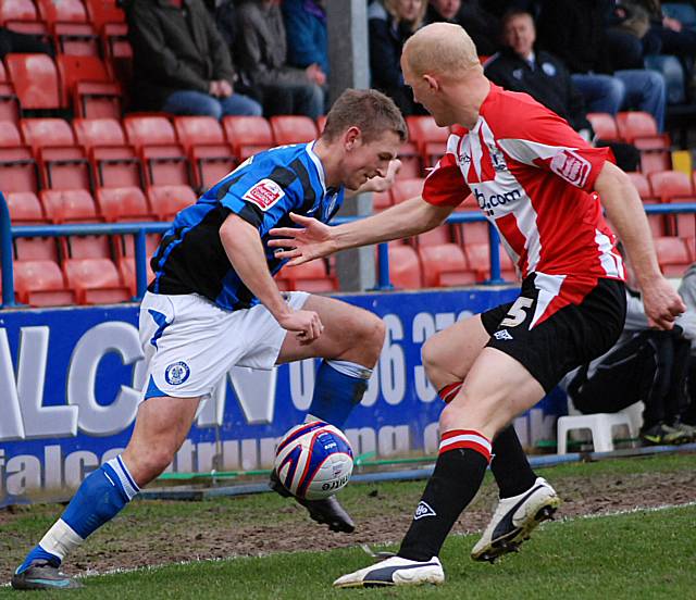 Jones comes up against Edwards tight on the touchline.