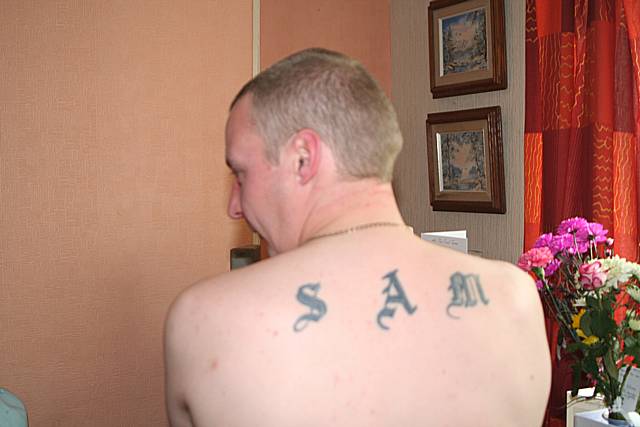 Always remembered: Dad Steven has Sam's name tattooed on his back