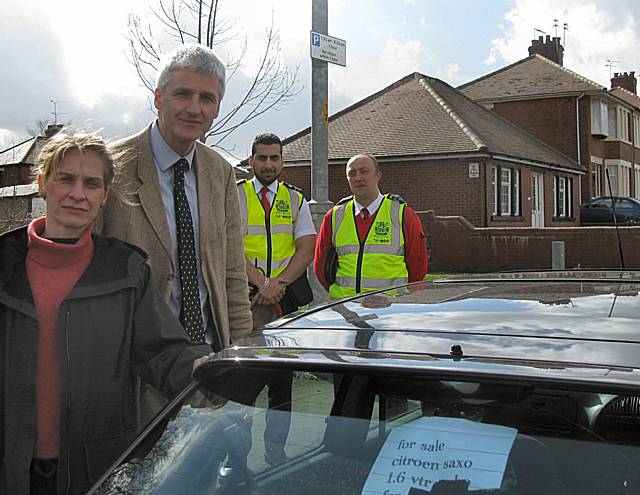 Curbing car sales on Bolton Road: Councillors Wera and William Hobhouse with members of the Council's Parking Services team.