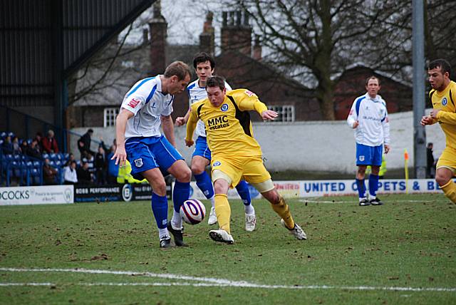 Ciaran Toner tries to get beyond Ryan Cresswell.