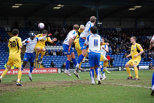 Simon Ramsden goes up for a header from another corner.