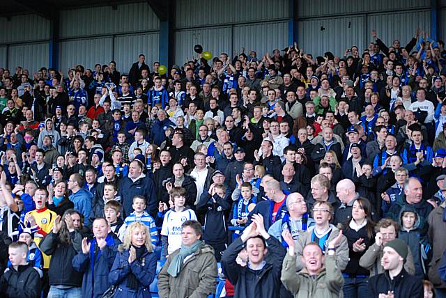 Dale fans get behind their team during the local derby.