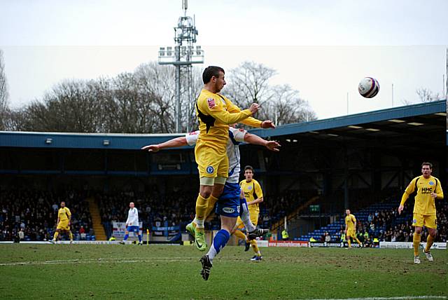 Le Fondre goes for goal with a backpost header.