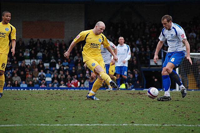 Lee McEvilly plays the ball forward.