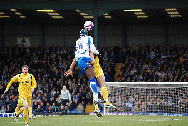 Efe Sodje wins a header against Lee Thorpe.