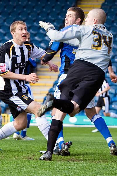 Tom Kennedy and Frank Fielding scramble the ball clear between them.