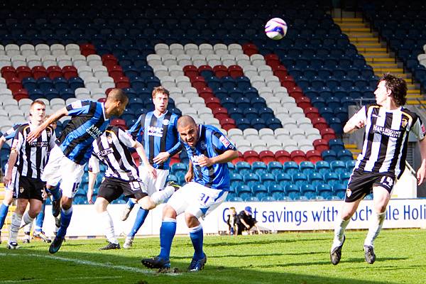 Thompson clears a Port Vale corner.