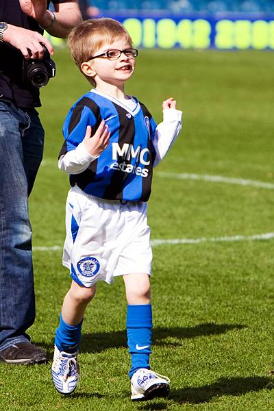 The young Dale mascot leaves the pitch before the start of the game.