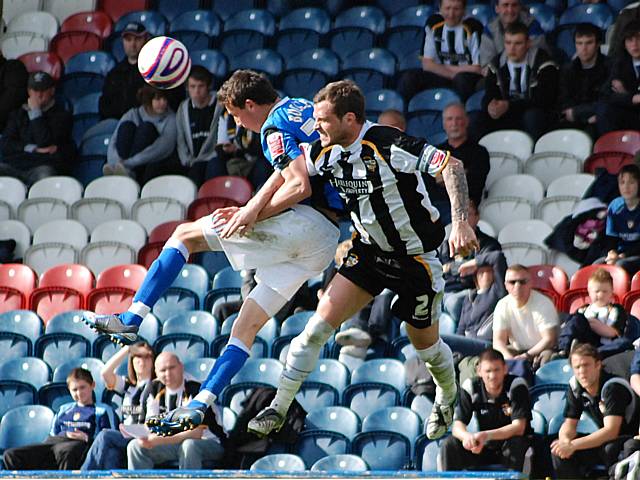 Ciaran Toner wins a header against Sam Stockley.