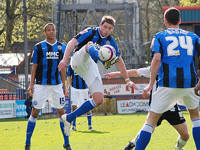 Toner hooks the ball upfield.